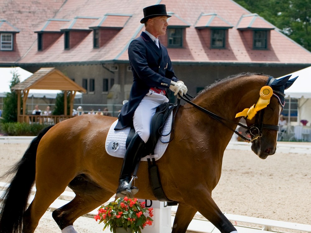 Ann Romney's horse, Rafalca, under the sure-handed guidance of trainer Jan Ebeling, trots around the ring after placing third in the National Grand Prix Dressage Championship at the United States Equestrian Federation Festival of Champions.
