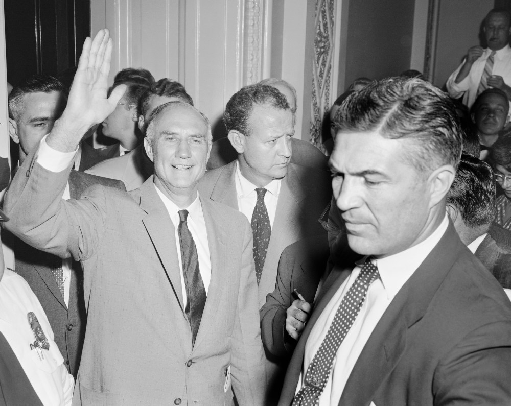 Sen. Strom Thurmond, D-SC, gives a wave as he leaves the Senate chamber, August 29, 1957 at end of his 24 hour, 19 minute one-man filibuster against the compromise civil rights bills.