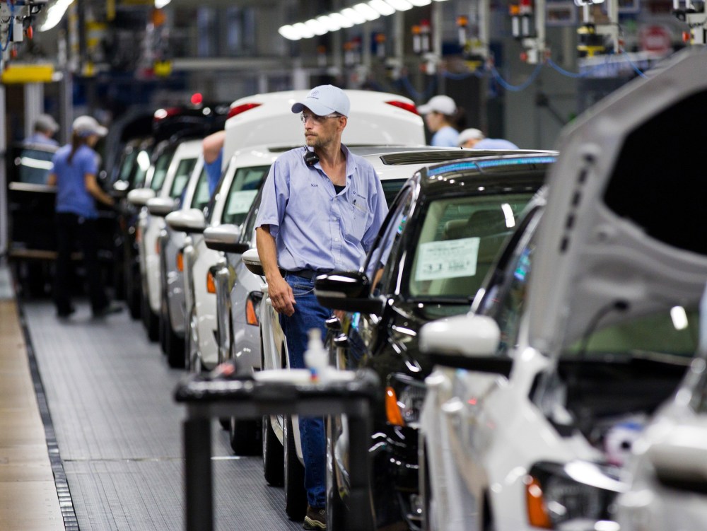 In this July 31, 2012 file photo, an employee at the Volkswagen plant in Chattanooga, Tenn., works on a Passat sedan.