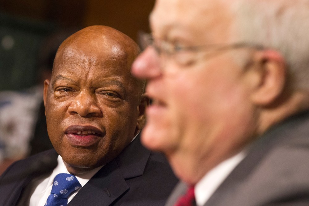 Rep. John Lewis, D-Ga., left, turns to thank Rep. James Sensenbrenner, R-Wis., as he finishes his testimony in support of the Voting Rights Act on Capitol Hill in Washington, July 17, 2013.