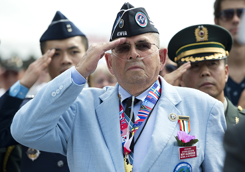 Roy Aldridge of the Korean War Veterans Association salutes during a ceremony to commemorate the 60th anniversary of the signing of the Armistice that ended the Korean War, at the Korean War Veterans Memorial in Washington, DC, July 27, 2013. (Photo by...