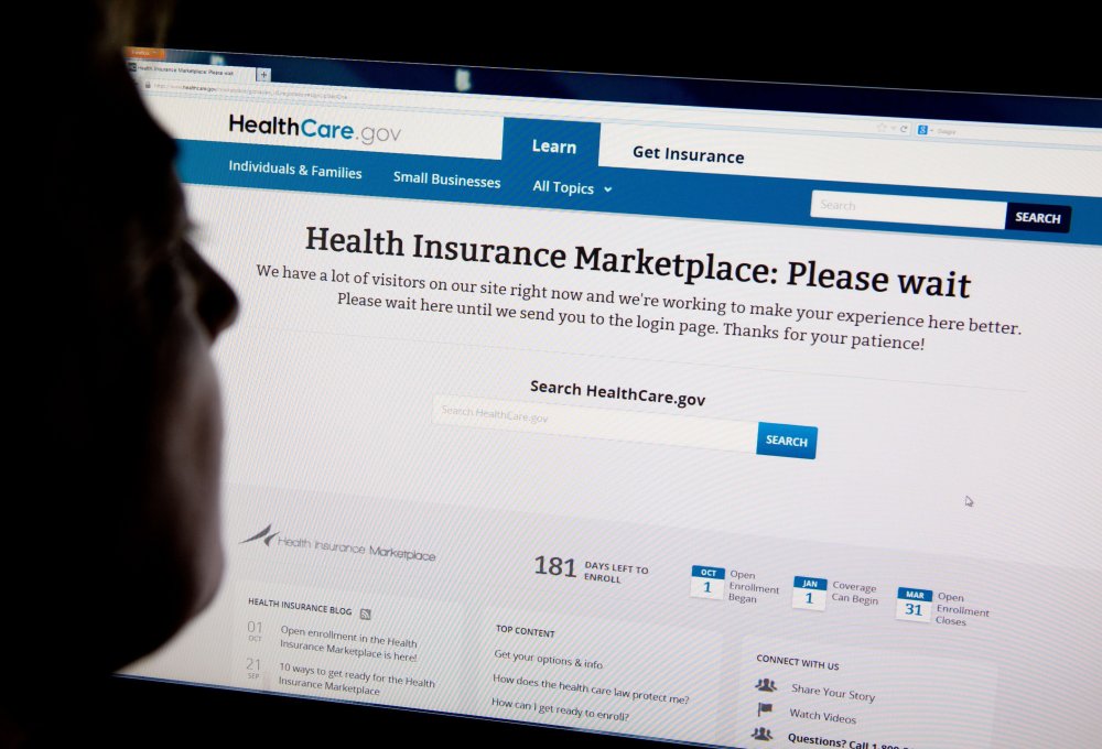 A woman looks at the HealthCare.gov insurance exchange, October 1, 2013 file photo.