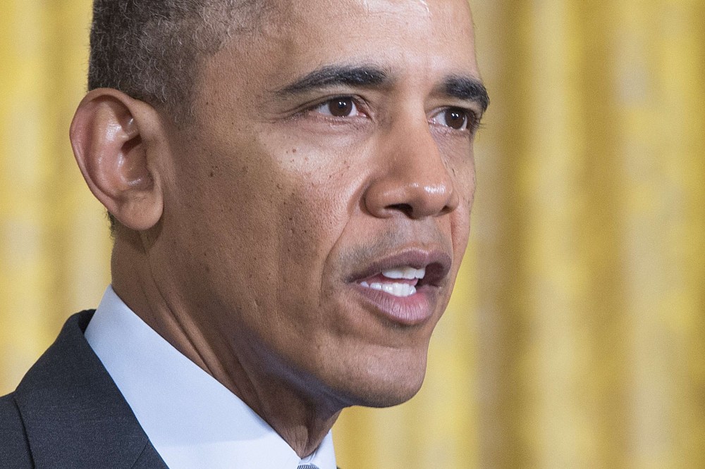 US President Barack Obama speaks before signing a memorandum directing the Federal Government not to discriminate against long-term unemployed job seekers at the White House in Washington, DC, Jan. 31, 2014.