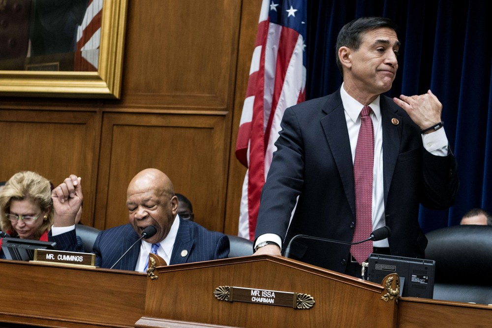 Committee chairman Rep. Darrell Issa (R-OH) (R) cuts ranking member Rep. Elijah Cummings (D-MD) off during a hearing of the House Oversight and Government Reform Committee on Capitol Hill on March 5, 2014 in Washington, DC.