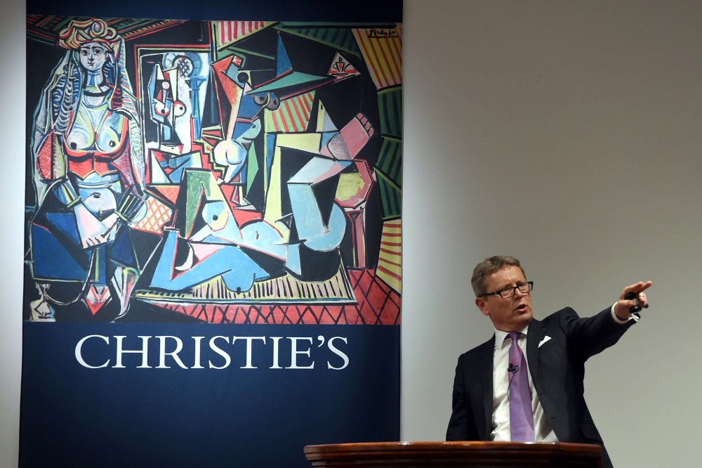 Auctioneer Jussi Pylkkanen takes bids on the Picasso masterpiece "Les Femmes d'Alger (Version O)" at Christie's in New York City on May 11, 2015. (Photo by Timothy A. Clary/AFP/Getty)