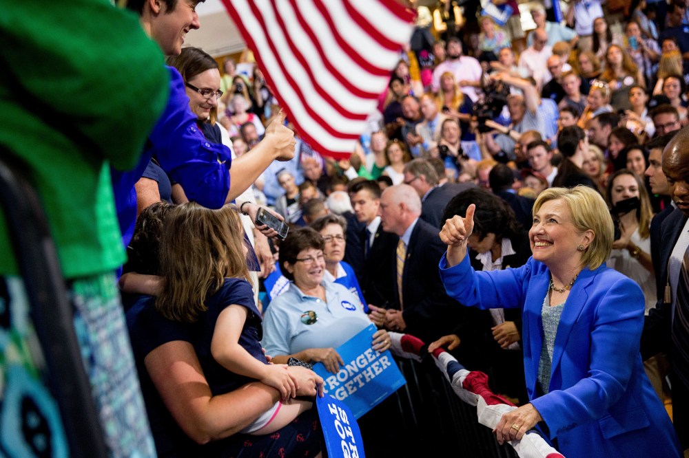 Democratic presidential candidate Hillary Clinton greets members of the audience during a rally in Portsmouth, N.H., July 12, 2016, where Sen. Bernie Sanders, I-Vt. endorsed Clinton for president.