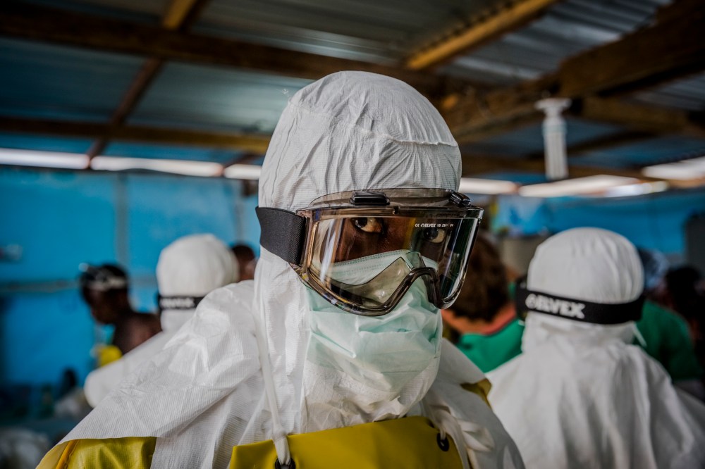Doctors Without Borders workers suit up in protective clothing before entering an Ebola ward at the Elwa Hospital in Monrovia, Liberia. (Daniel Berehulak/The New York Times/Redux)