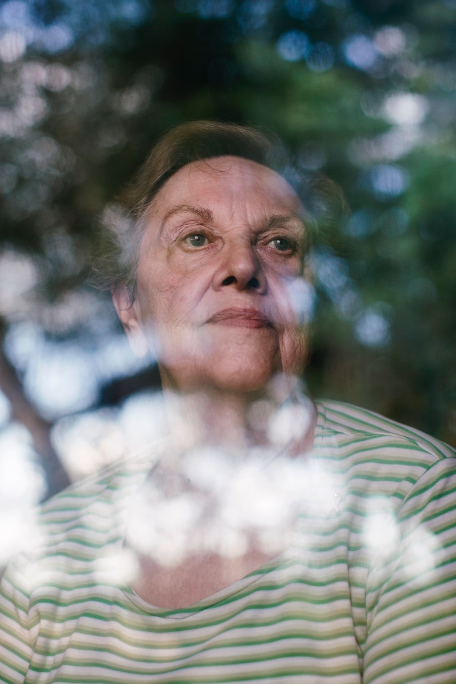 Pamela Taylor looks out of her front window where it's common for her to see immigrants crossing her property, in Brownsville, Texas. (Photo by Bryan Schutmaat for MSNBC)