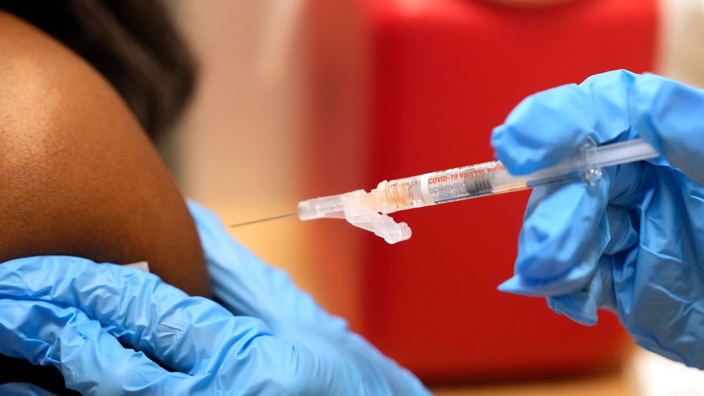 A pharmacist gives a COVID-19 vaccine in Cypress, Texas in 2023.