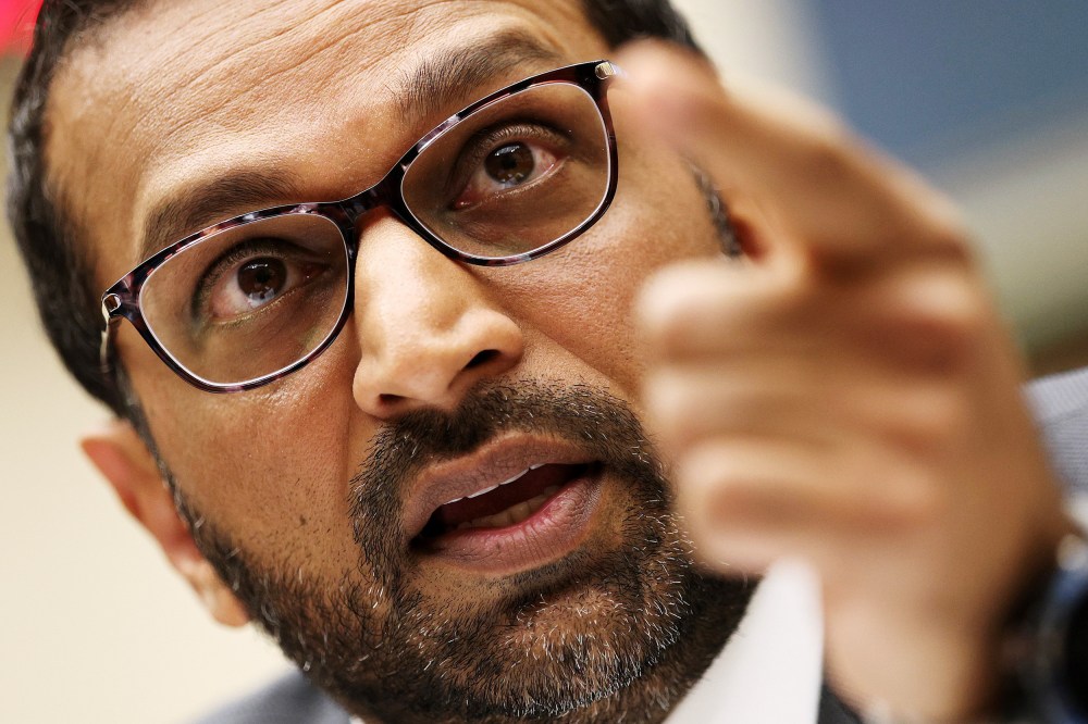 FBI Director Kash Pate points while speaking