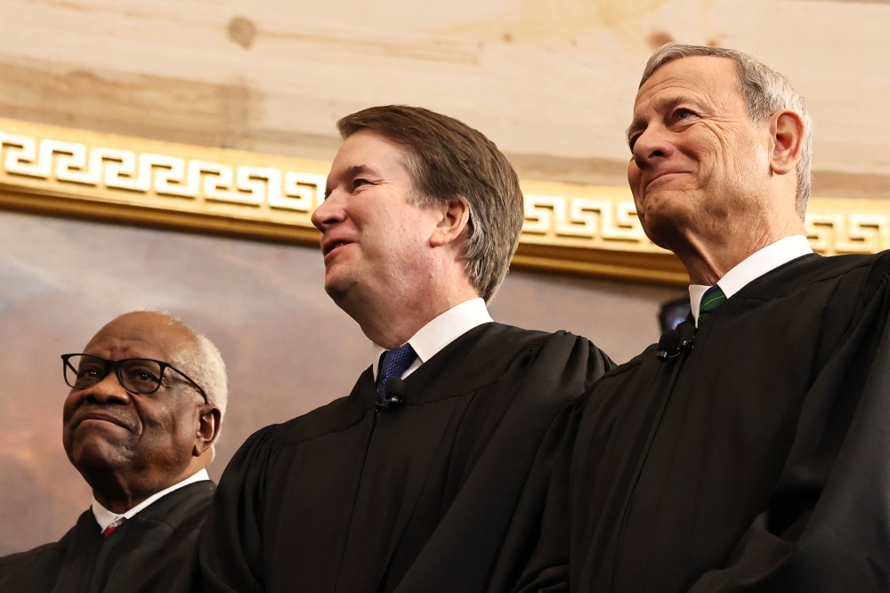 Associate Supreme Court Justices Clarence Thomas and Brett Kavanaugh and Supreme Court Chief Justice John Roberts during Donald Trump's inauguration in the Capitol.