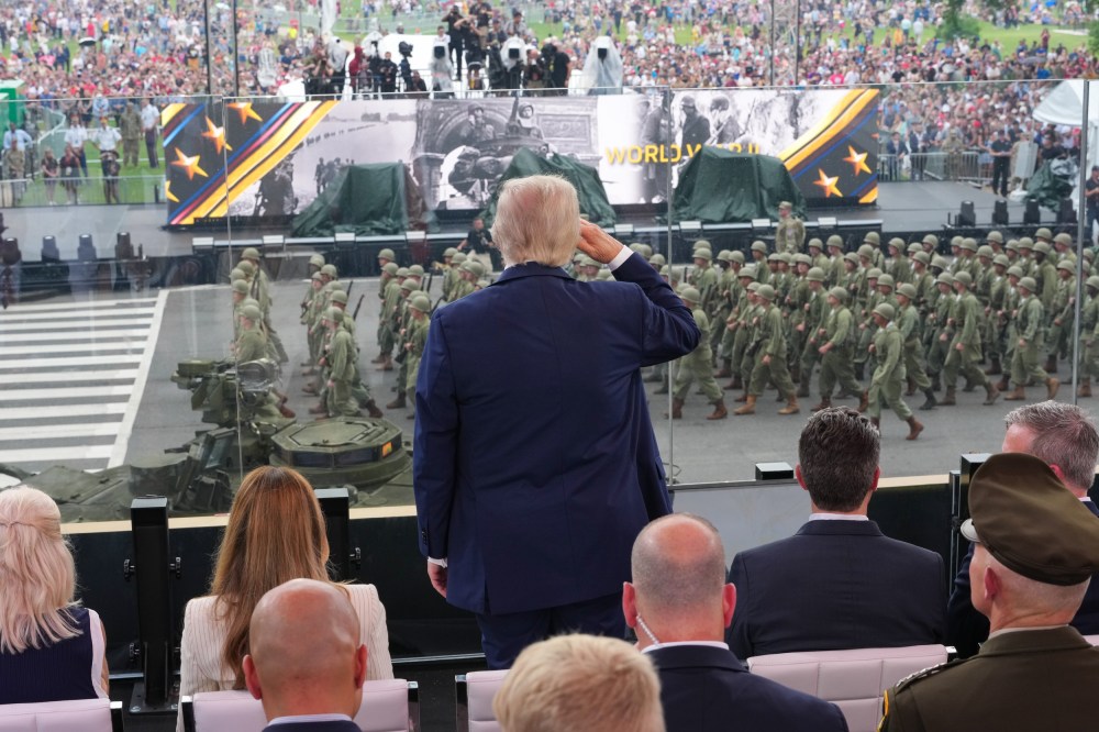 President Donald Trump salutes Army troops on the National Mall.