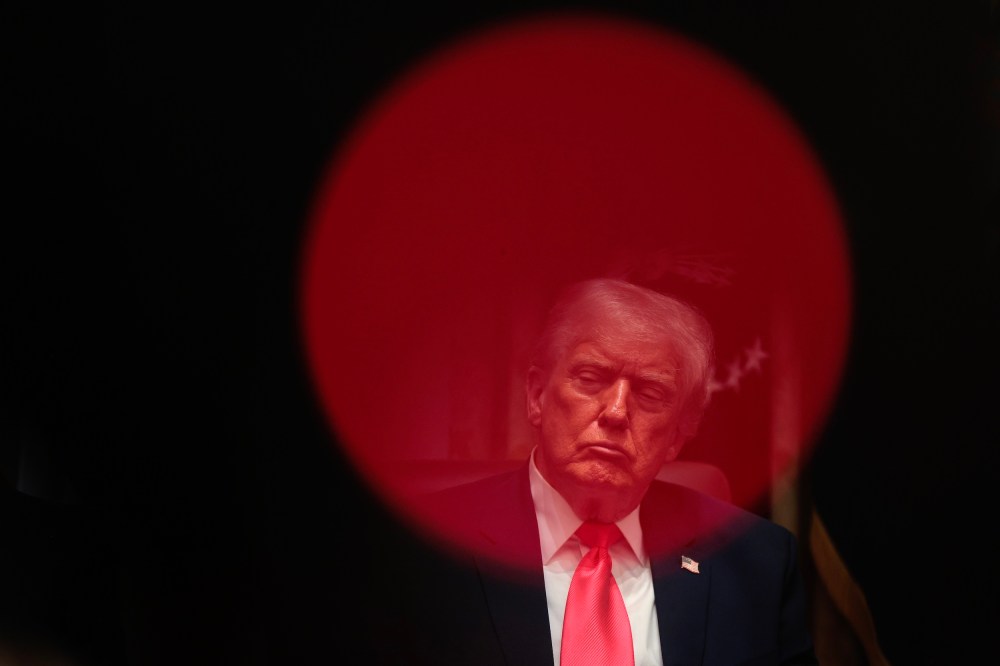 President Donald Trump sits in the Cabinet room.