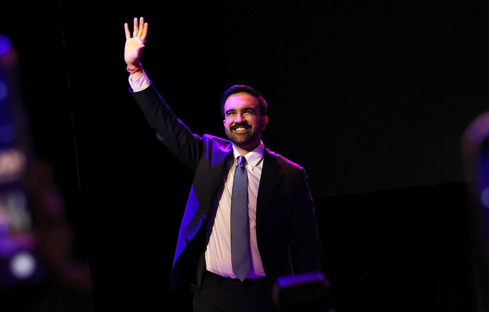 Zohran Mamdani waving to the crowd in Brooklyn, NYC.