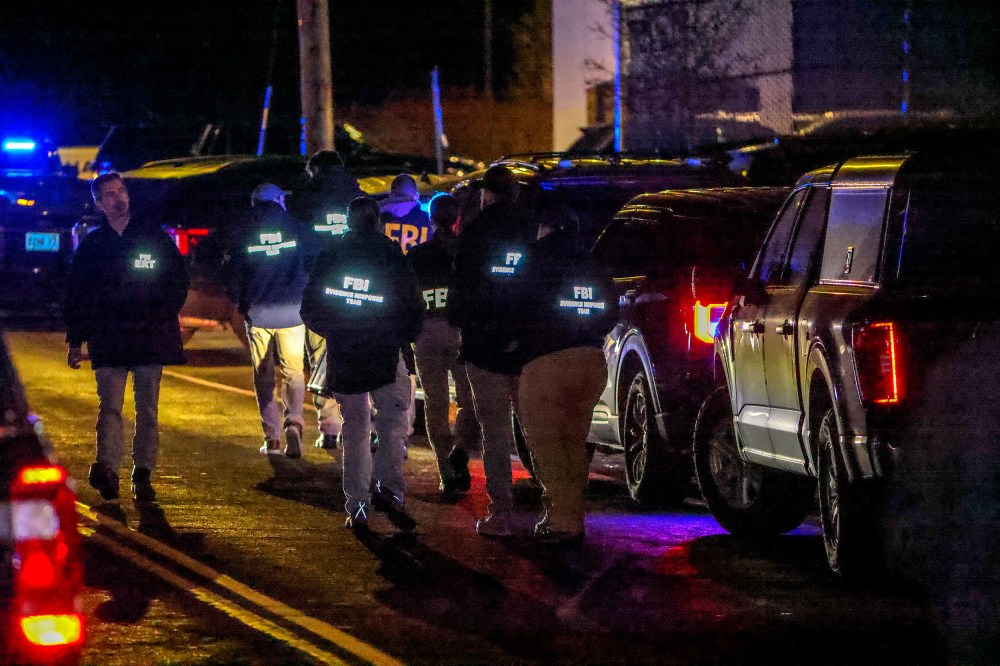 A team of FBI agents arrive on the scene at the Extra Space Storage facility in Salem, N.H.