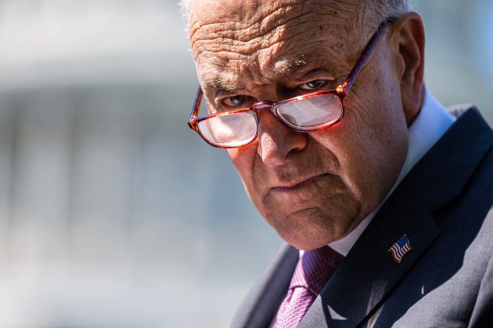 Senate Minority Leader Chuck Schumer attends a news conference outside the Capitol.