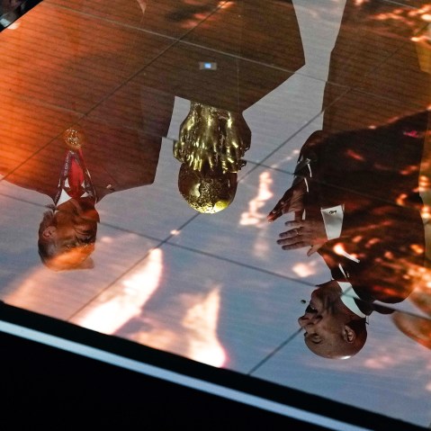 Donald Trump, left, and Gianni Infantino reflected in the floor of the Kennedy Center.