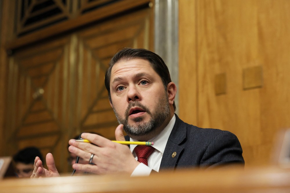 Ruben Gallego speaks while holding a pencil.