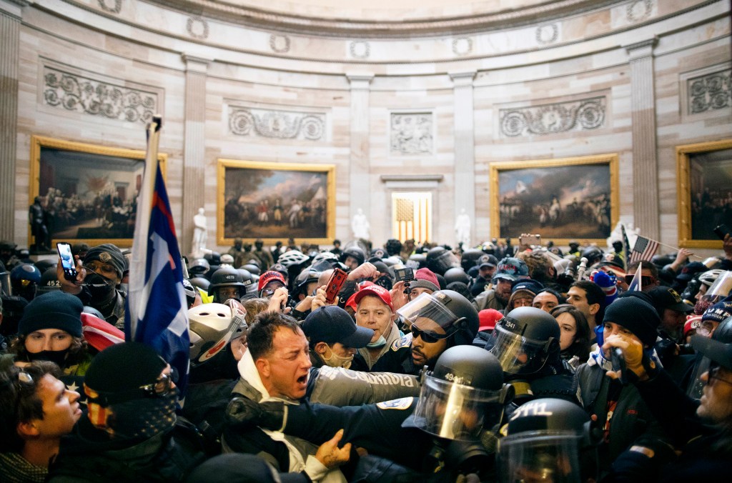 Police clash with supporters of US President Donald Trump who breached security and entered the Capitol building on Jan. 06, 2021.