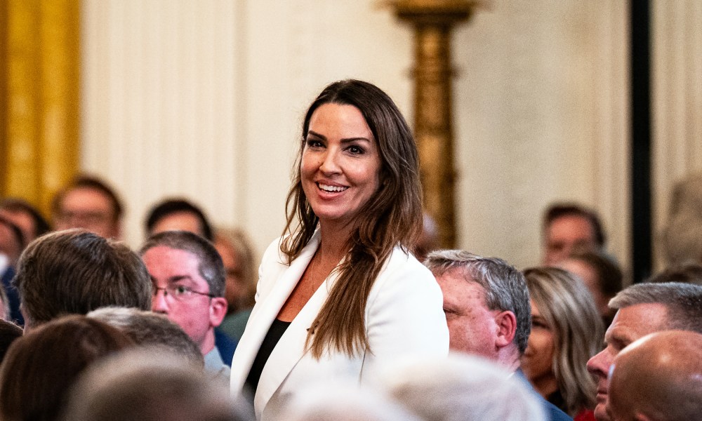 Sara Carter during a bill-signing ceremony on July 16, 2025, in the East Room of the White House.