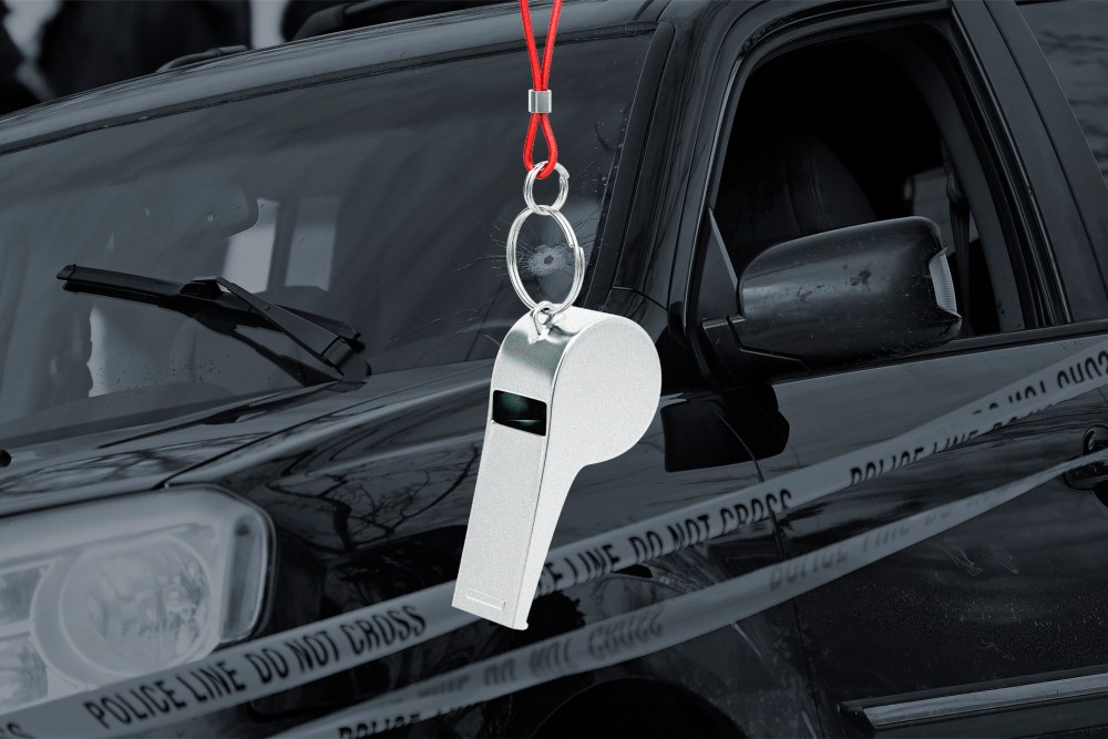 A photo illustration of a whistle in front of Renee Good's vehicle after being involved in a shooting by an ICE agent during federal law enforcement operations.
