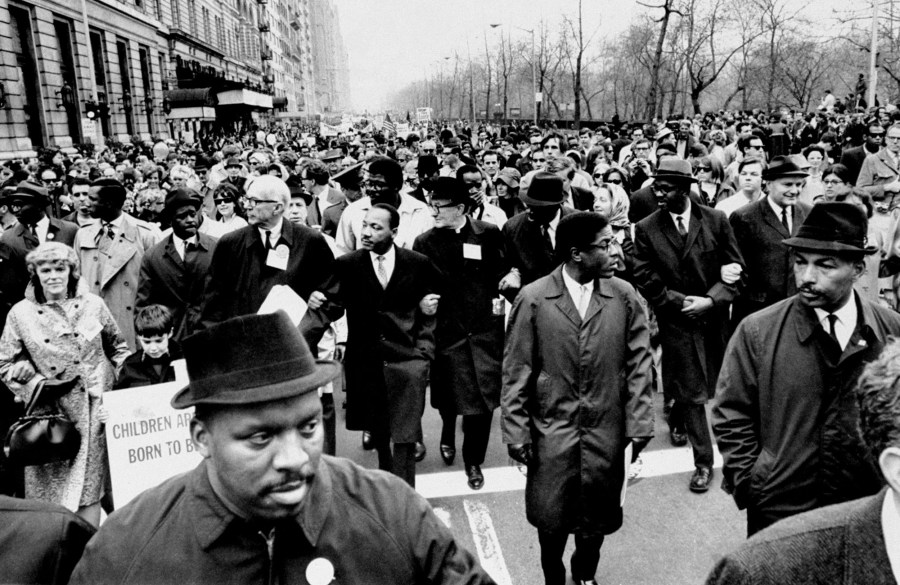 Dr. Benjamin Spock and Rev. Martin Luther King Jr. (center) protest against the Vietnam War along Central Park West on April 16, 1967.