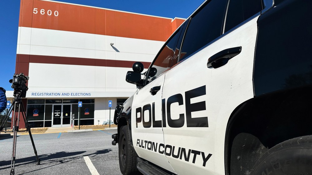 Police vehicles are seen outside the Fulton County elections hub on Jan. 28, 2026, in Union City, Ga.