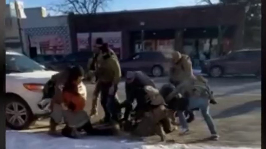 Federal agents shove man