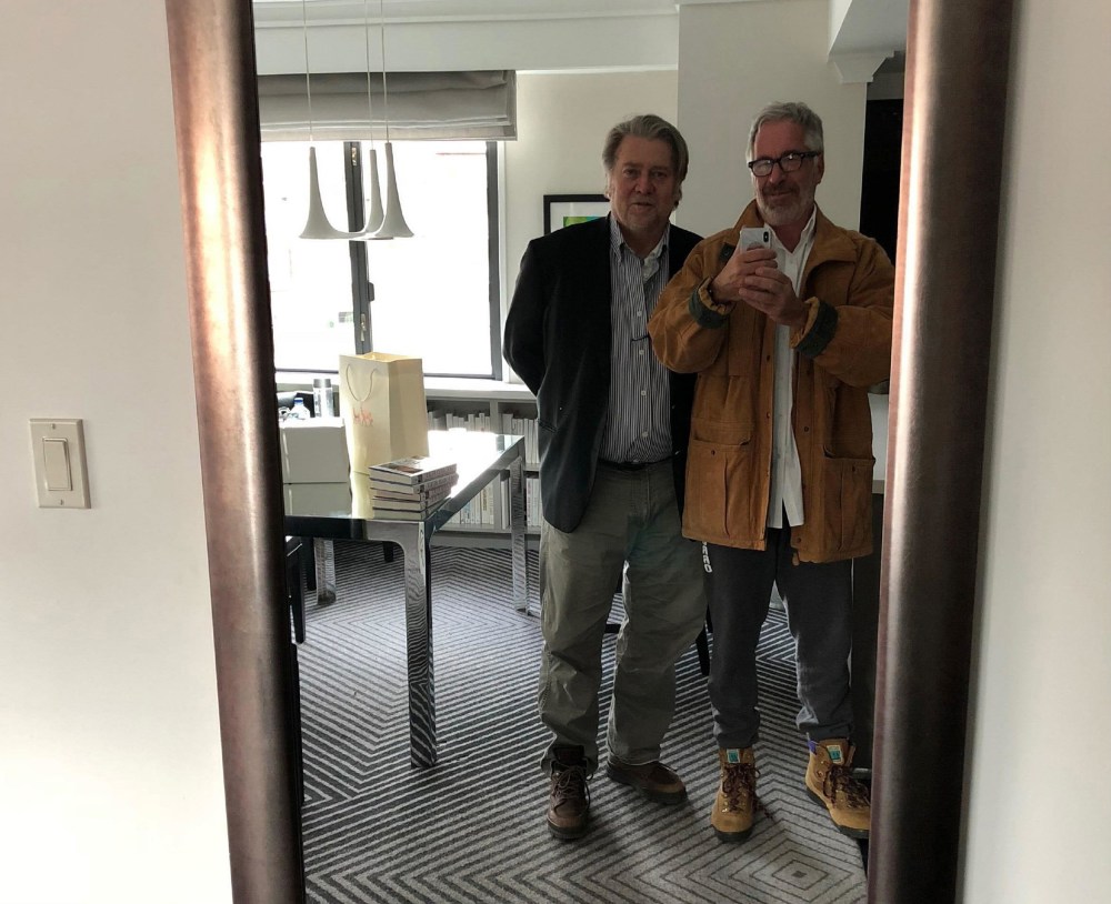 Jeffrey Epstein, right, takes a mirror selfie of him and Steve Bannon.