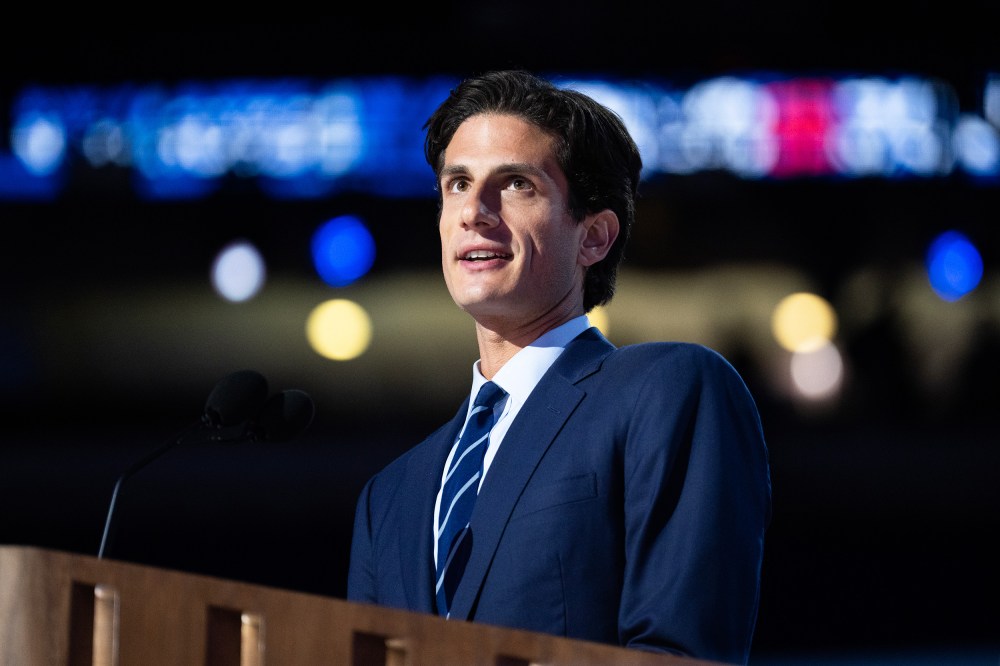 Jack Schlossberg behind a podium with a microphone.
