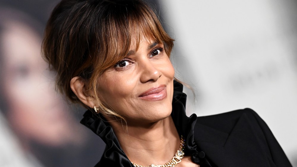 Halle Berry poses for photos at a red carpet event.