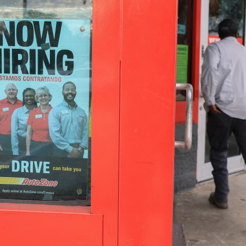 A man enters an AutoZone store.