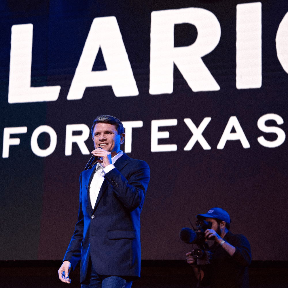Texas Senate candidate James Talarico (D-TX) (R) speaks at a campaign rally after being introduced by social media personality and influencer Carlos Eduardo Espina, left, on March 2, 2026 in Houston, Texas